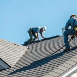 Professional roofing contractor working on residential roof in Houston Texas